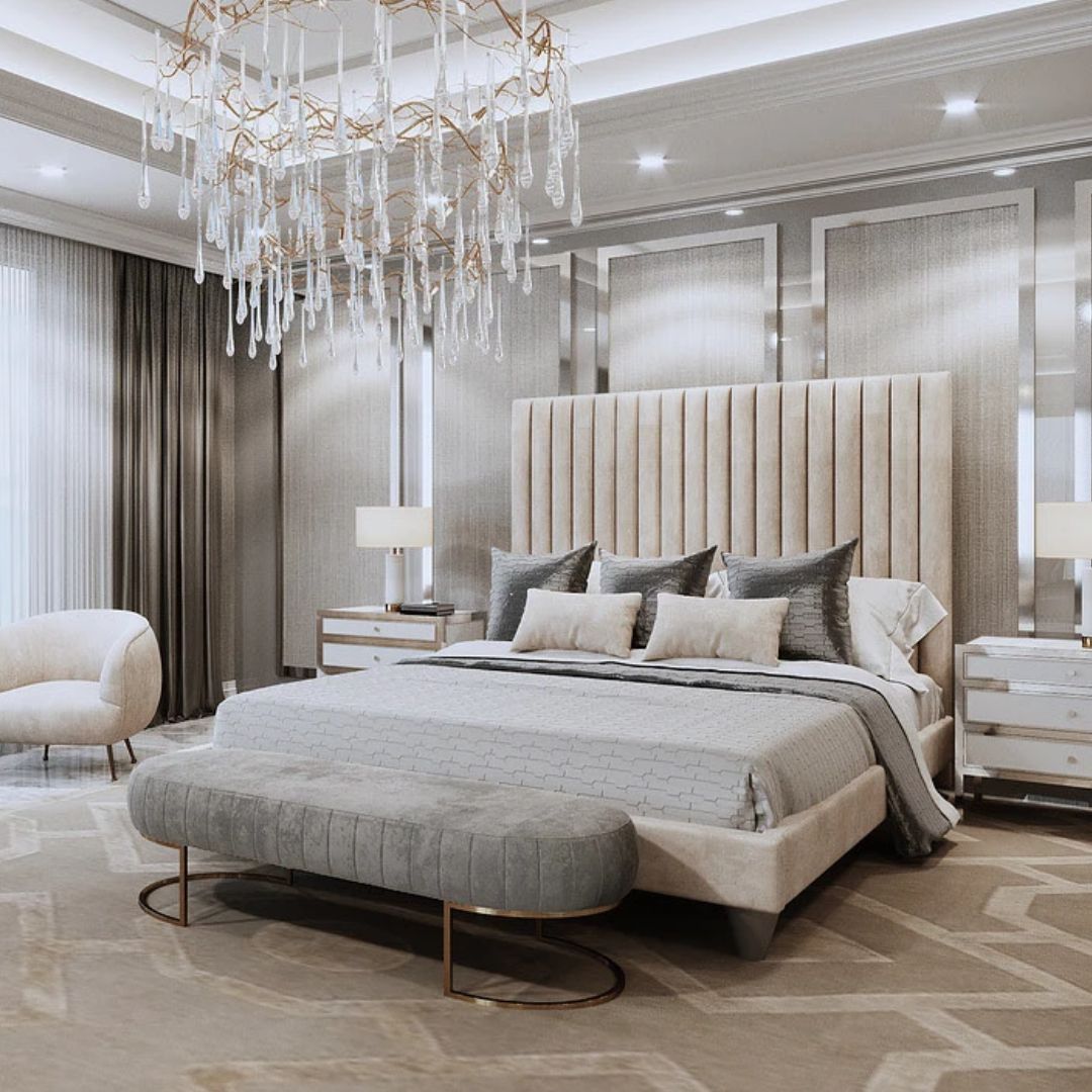 Luxurious bedroom with a large bed, chandelier, and modern decor.